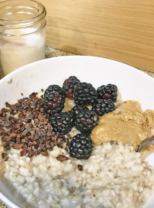 steel cut oats with peanut butter blackberries and cacao nibs